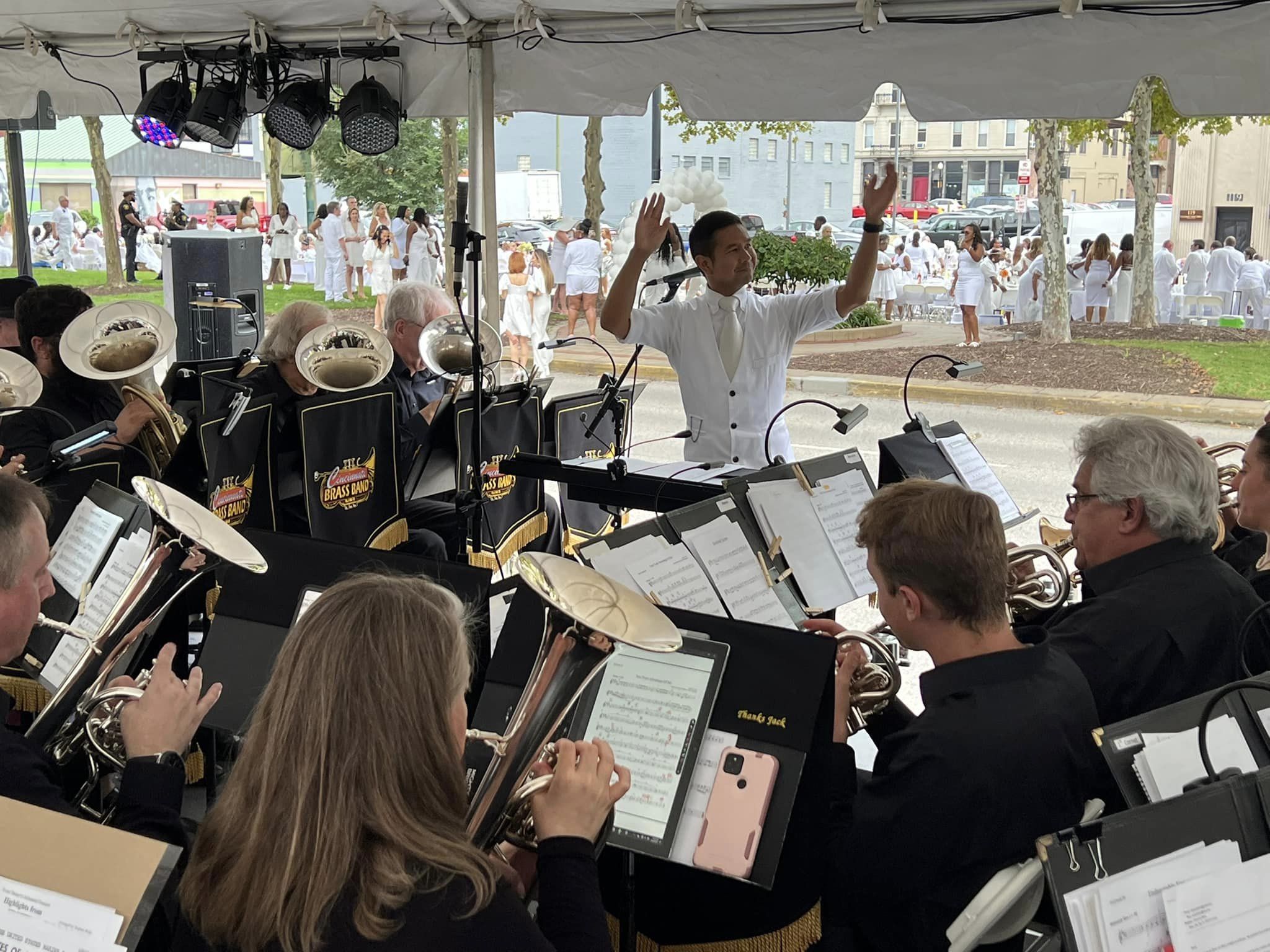 Dr. Thomas Gamboa conducting the Cincinnati Brass Band at Diner en Blanc